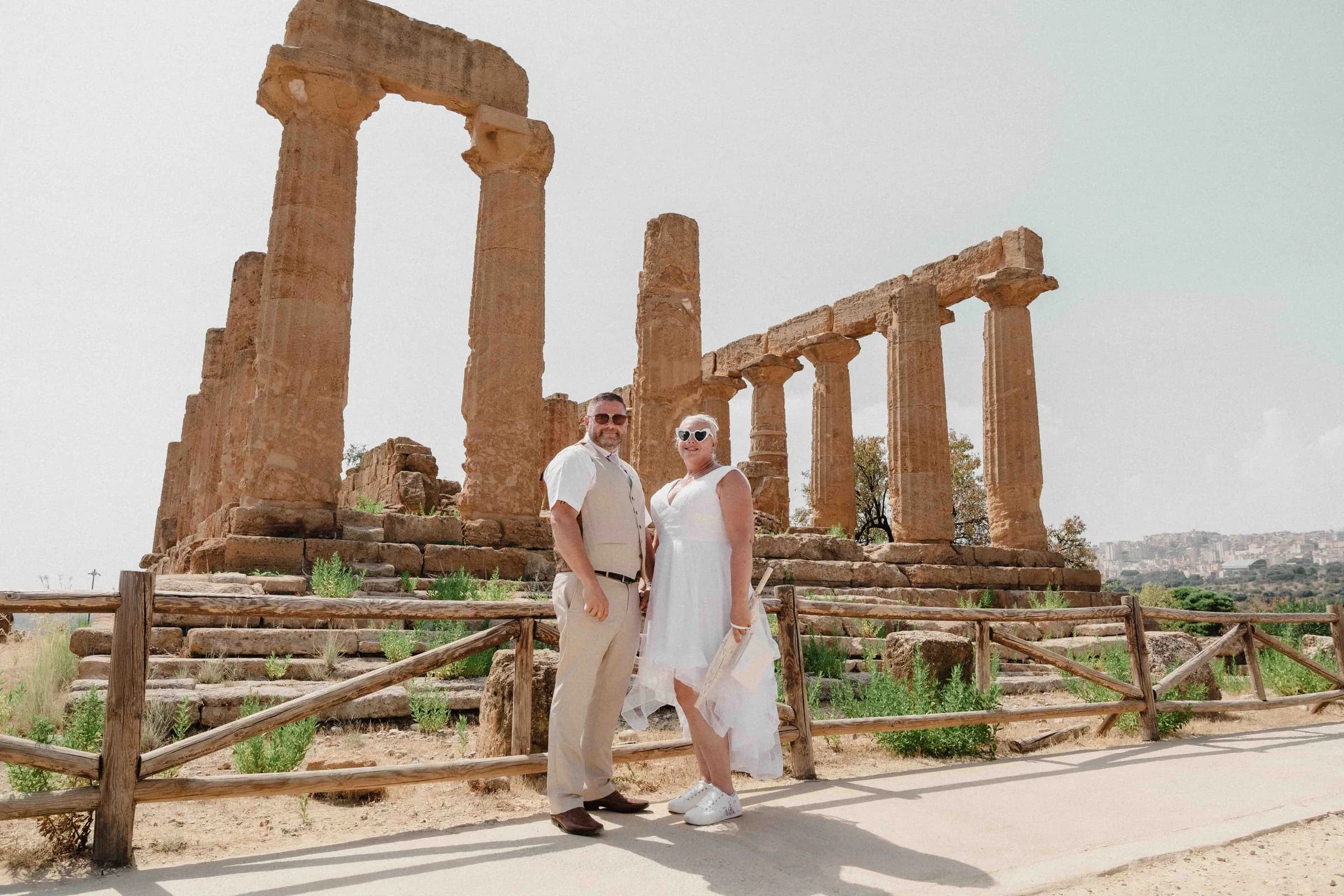 A groom walking toward the columns of the Temple of Juno in the Valley of the Temples