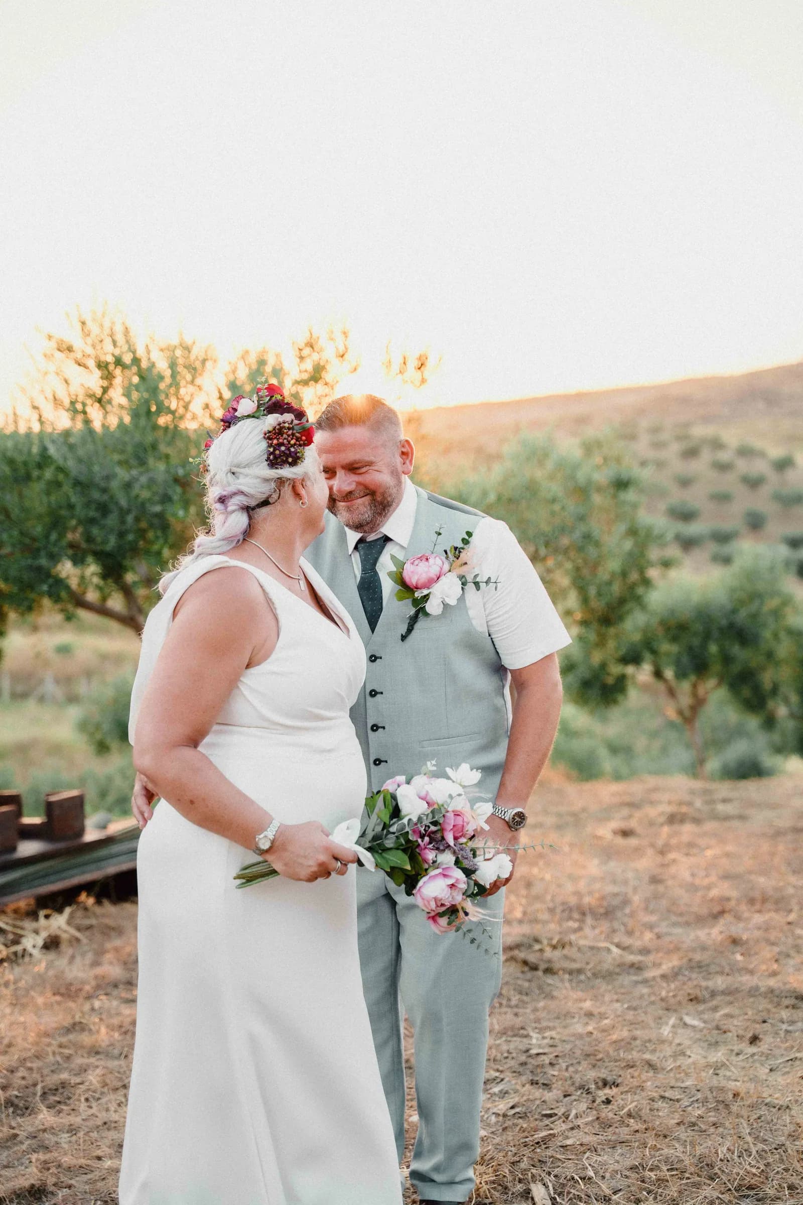 A couple in the olive grove at the last hour of light